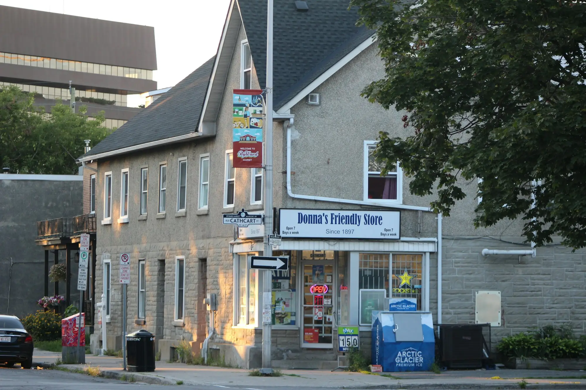Small old corner store building with a painted sign